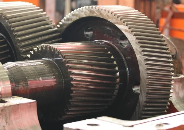 How do different materials used in gears impact the durability of a gearbox?